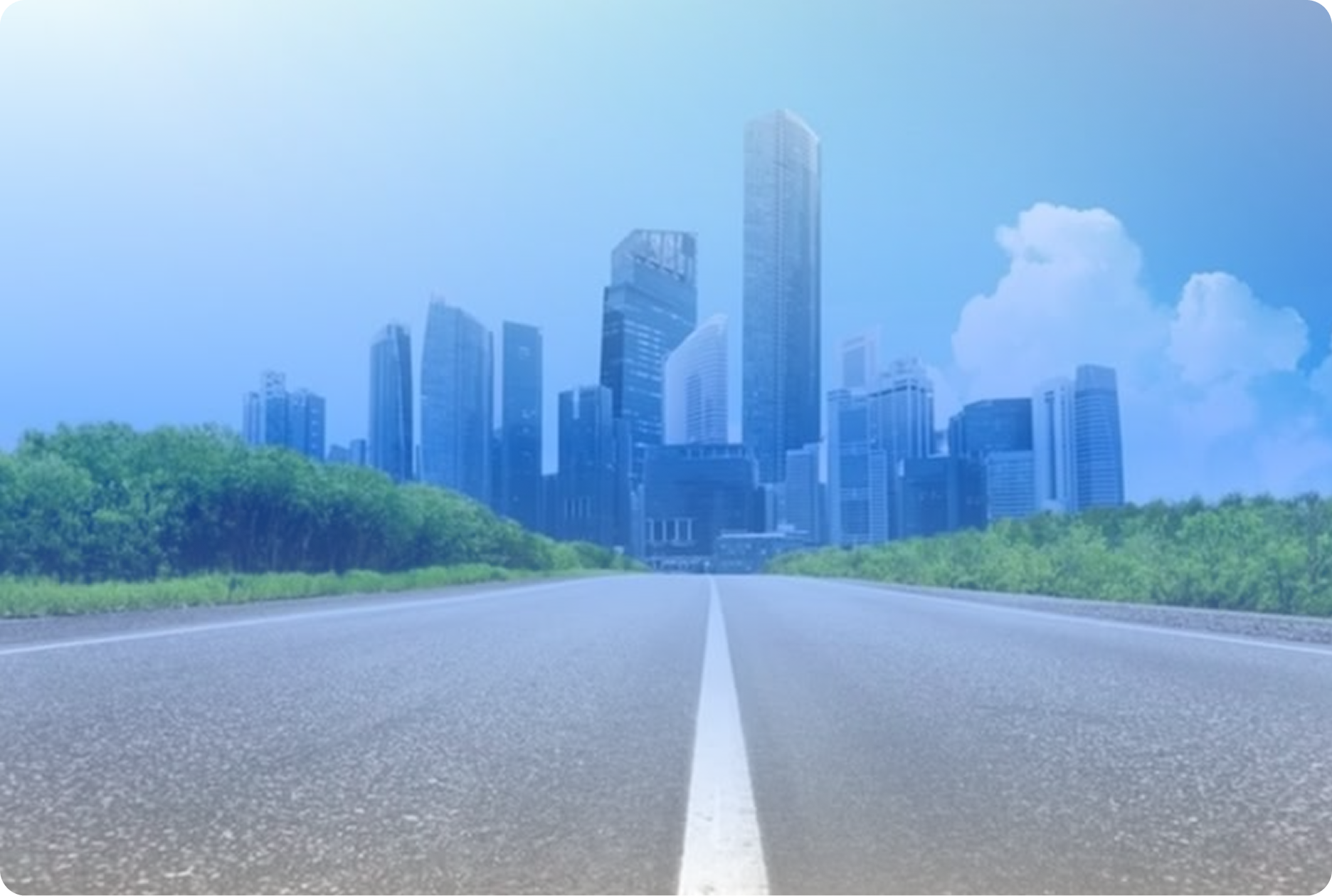 Road leading into a city skyline
